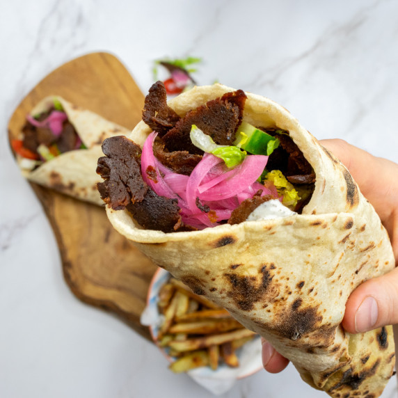 Shot of my hand holding up a setian doner kebab