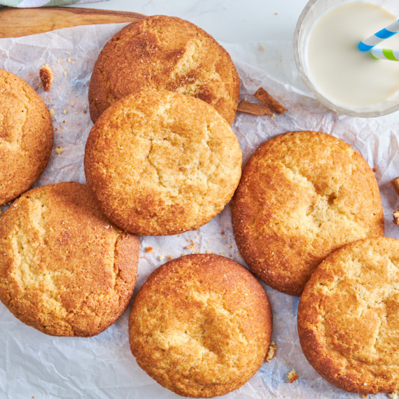 Soft & Chewy Protein Snickerdoodles with Sourdough Discard from above, with a glass of milk 