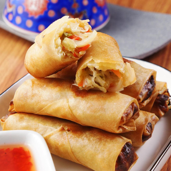 chicken spring roll stacked on a plate