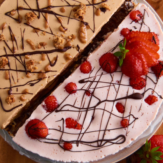 2 halves of a Protein Mousse pie, one strawberry, one banoffee