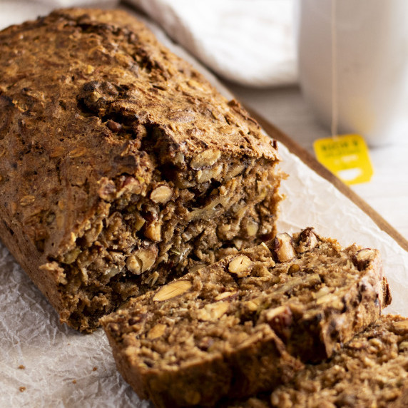 Two slices cut off a loaf of super nutty apple cinnamon bread.