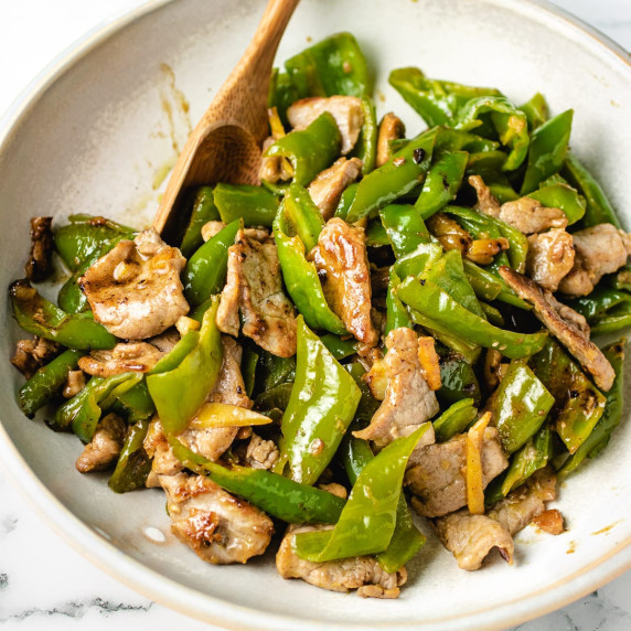 Pork and peppers on a white plate