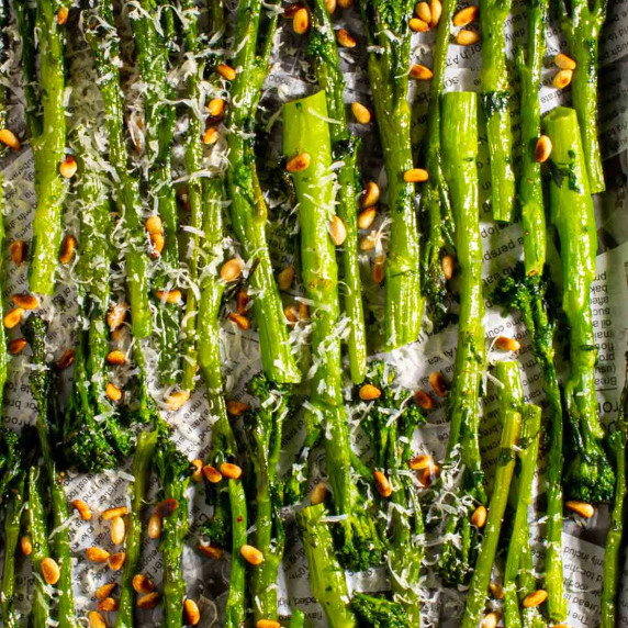 Roasted tenderstem broccoli on a baking sheets.