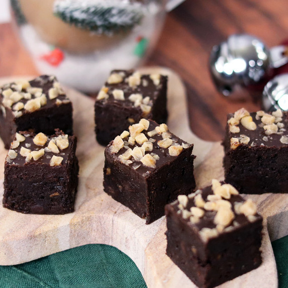 Toffee crunch flourless brownies on a gingerbread man serving tray