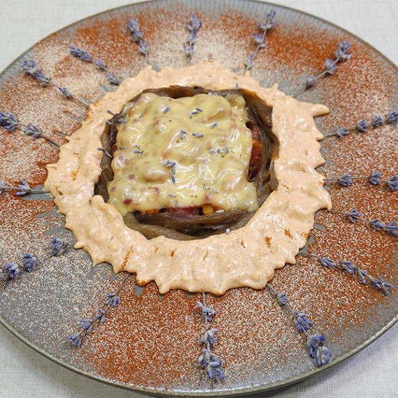 Cooked eggplants with cheese on a plate