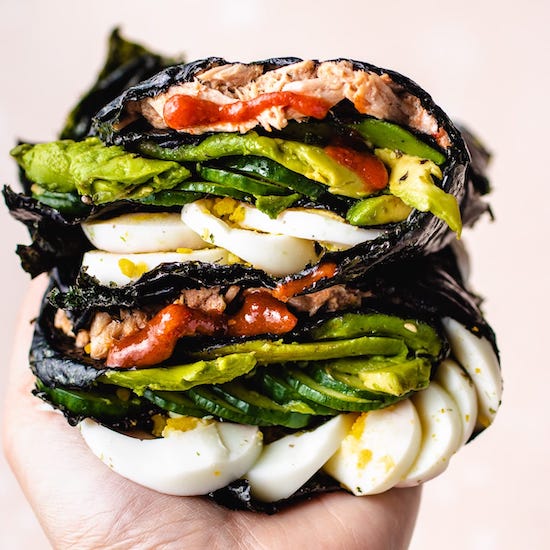 Tuna, sliced avocado, sliced boiled egg, sriracha, mayo in nori sliced in half