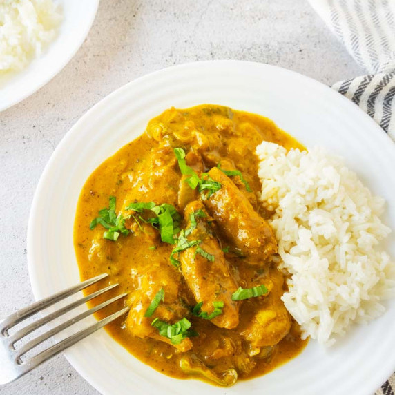 Vadouvan Spice Curry chicken and rice on plate.