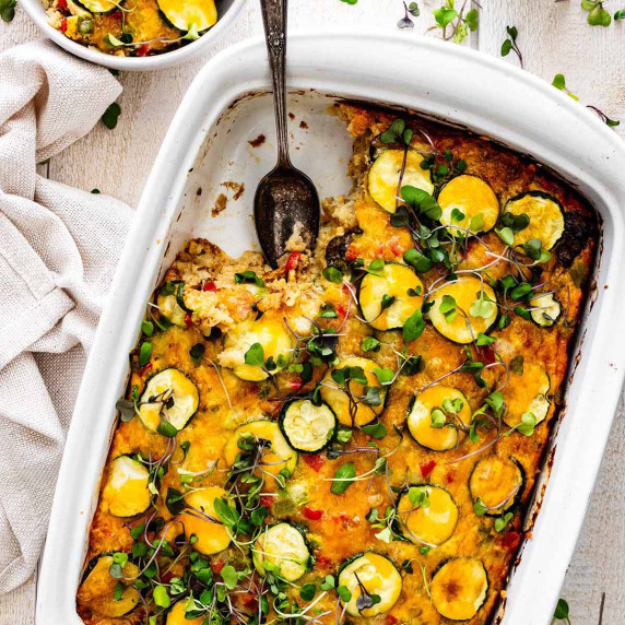 Vegetarian tater tot breakfast casserole in a white ceramic casserole dish