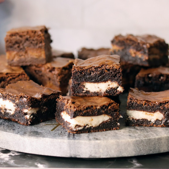 York Sensation Brownies piled on a marble serving board