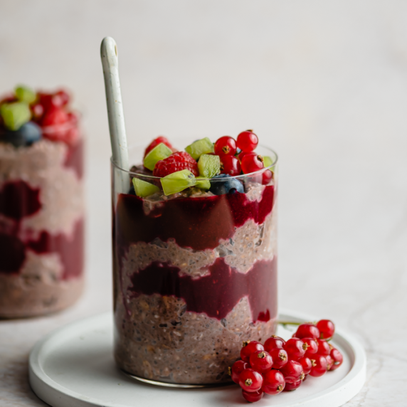 Acai Overnight Oats arranged in an aesthetic cup with straw and acai on the side