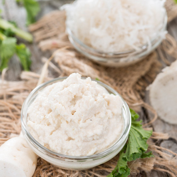 Apple horseradish sauce in a glass bowl.