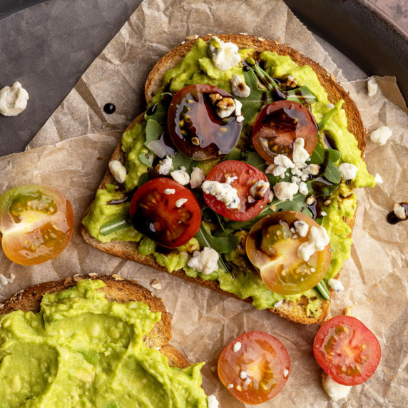 Avocado toast with balsamic glaze on a tray