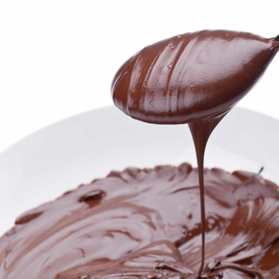 bowl of ganache hot fudge topping made with Bailey's Irish cream liqueur.