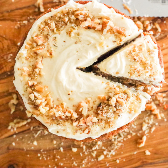 Homemade carrot cake with chopped walnuts and cream cheese frosting