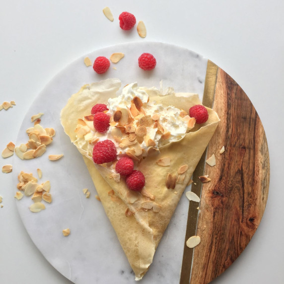crepe filled whith whipped cream, rasberries and almonds