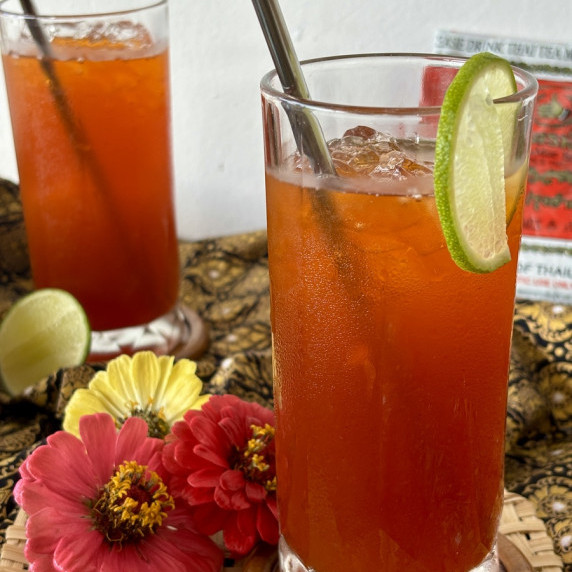 Two servings of cha manao, Thai iced tea.