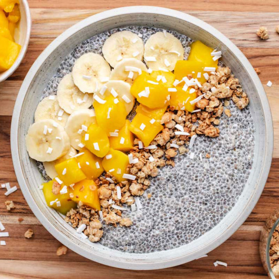 Chia bowl with diced mango, sliced banana, and granola on top.