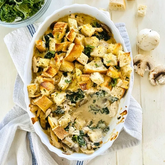 kale and chicken casserole with a serving taken out.