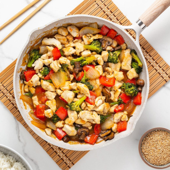 chicken and broccoli stir fry in the pan