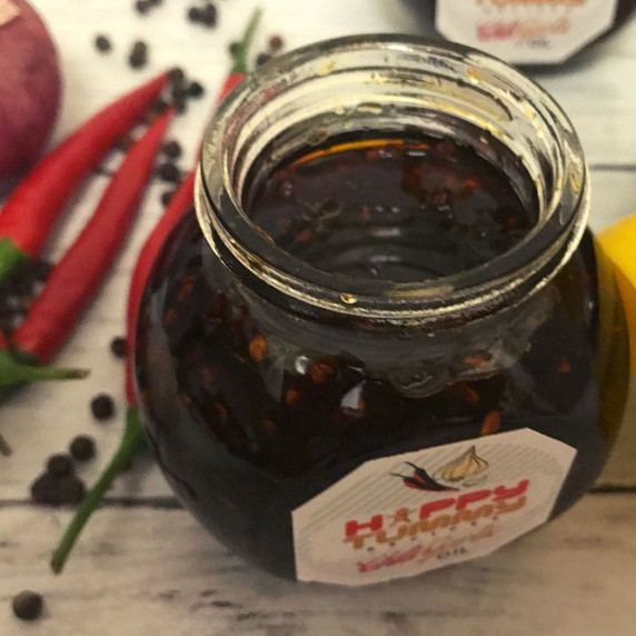 chili garlic oil in a small clear container