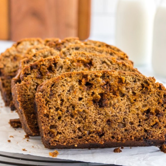 Cinnamon Banana Bread on parchment paper on a wire rack