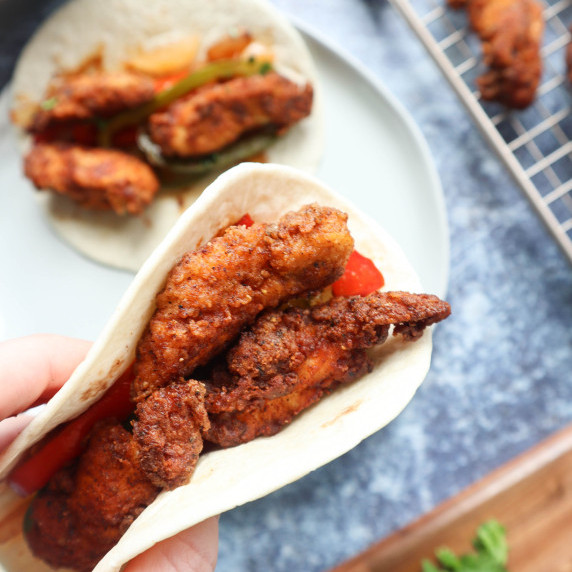 tortilla with fried chicken, peppers and onion 