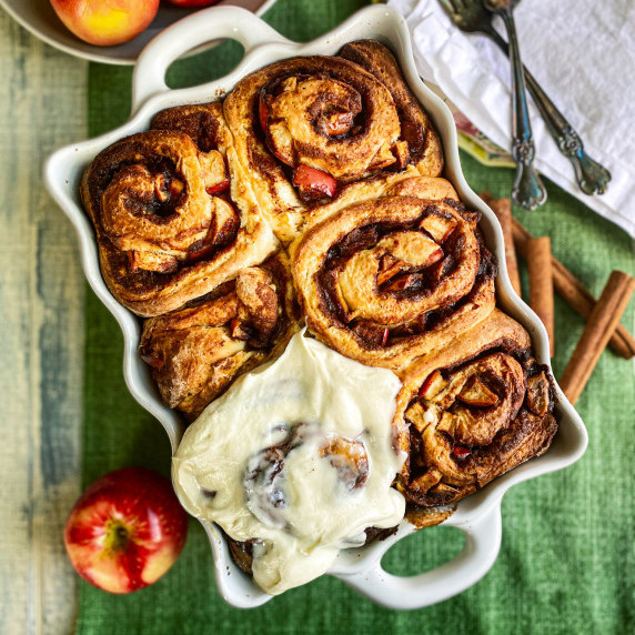 apple cinnamon rolls with apples and cinnamon sticks 