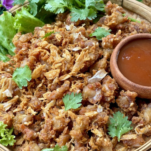 Fried chicken knuckles served with Thai hot sauce.