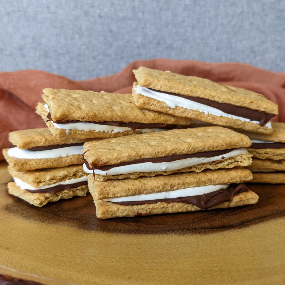 A pile of frozen s'mores bites made with graham crackers, marshmallow fluff, and Nutella