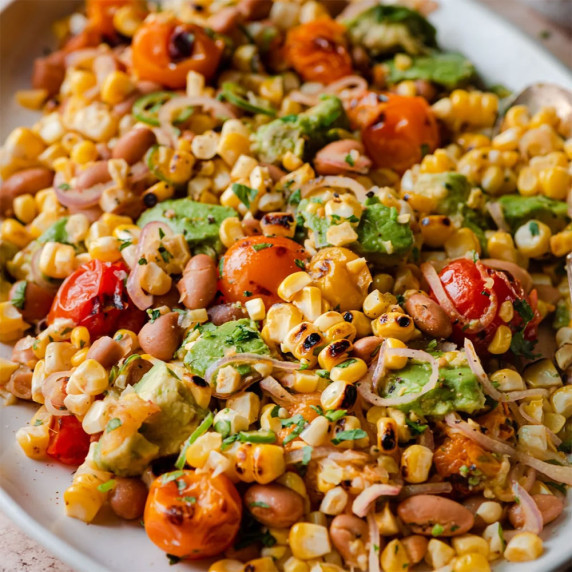 Grilled corn salad on a platter.