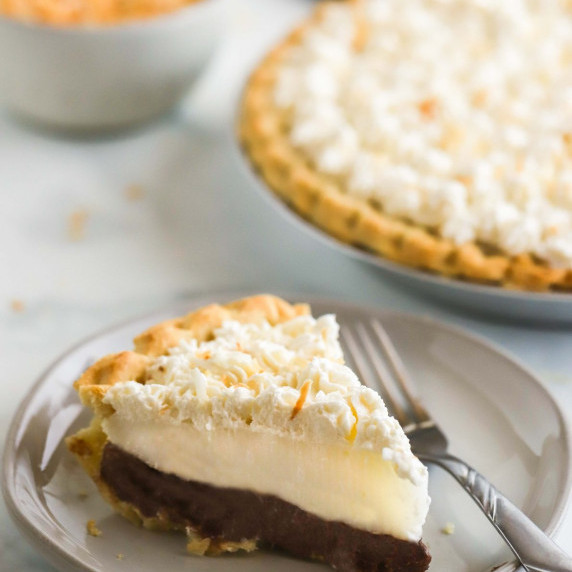 A piece of haupia pie on a white plate.