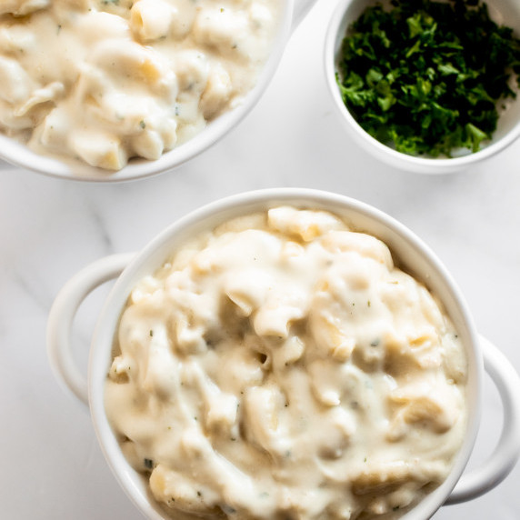 macaroni and cheese in a white bowl