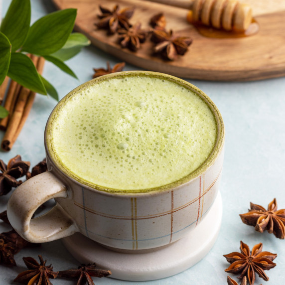 Matcha chai latte in a mug on a coaster