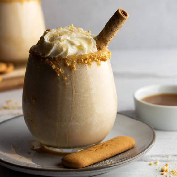 Milkshake with no ice in a glass with toppings