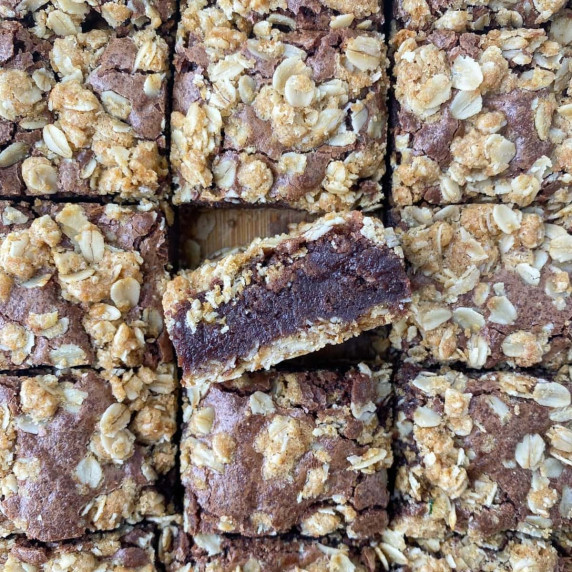 top view of sliced oatmeal brownies with one brownie turned on its side