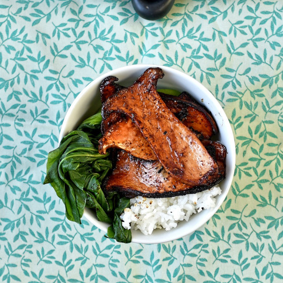 vegan and gluten free oyster mushroom char sui in a bowl with rice and pak choi
