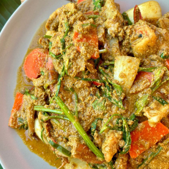 Pad pong karee talay, yellow curry seafood stir-fry, ready to be served.