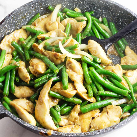 wok full of stir fried Panda Express string bean chicken.