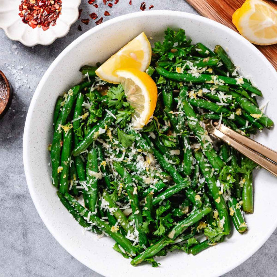 green beans in a bowl with cheese.