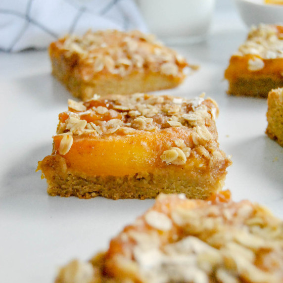 peach crisp cookie bars on marble background