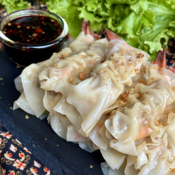 Pork and shrimp wonton with dipping sauce.