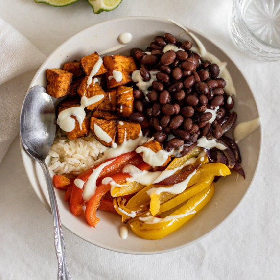 rice bowl with beans, red peppers, yellow peppers and sweet potato 