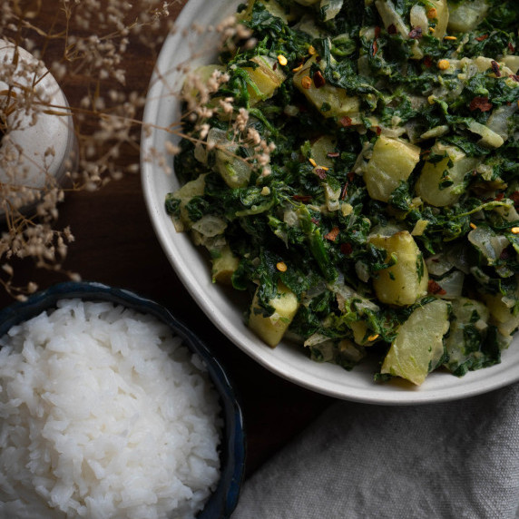 A bowl of saag aloo.