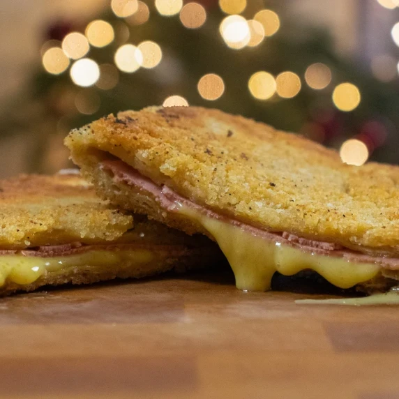 Vegan cordon bleu cut in half and vegan cheese oozing out the middle