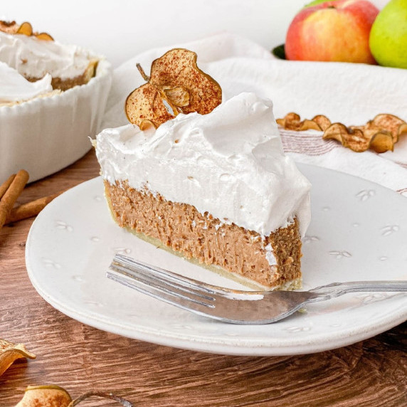 Slice of Cinnamon Pie with Apple Cider Meringue on a white plate.