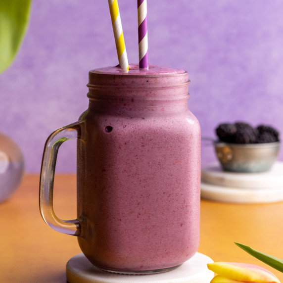 Strawberry blackberry banana smoothie in a jar