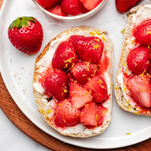 Toast with roasted strawberries, cream cheese, and lemon zest.