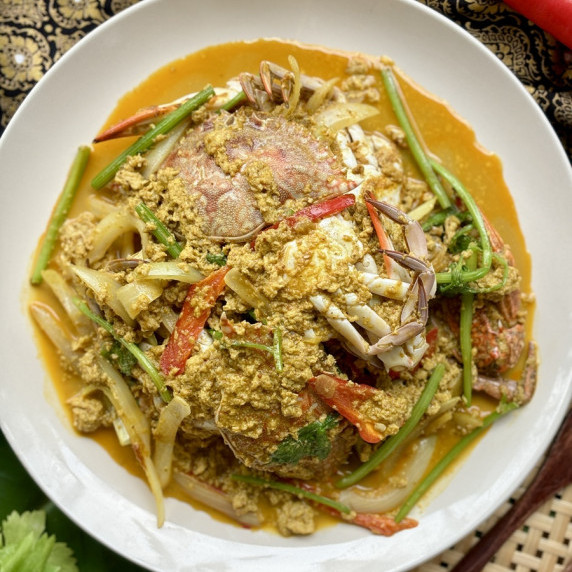 Thai crab curry served in a white dish.