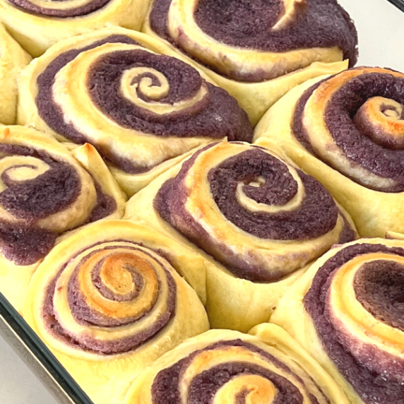 ube bread rolls in pan