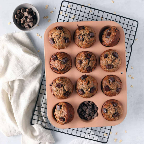 vegan chocolate chip banana muffins in a pink pan